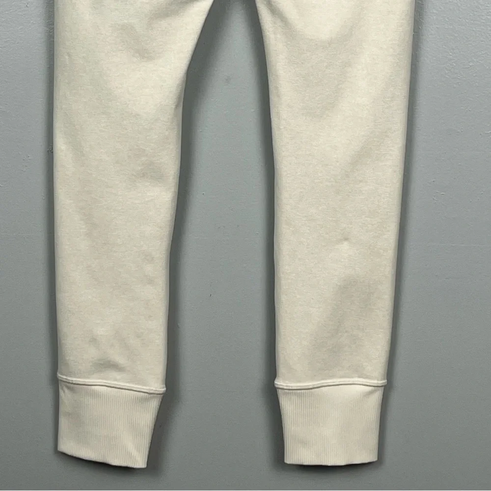 Athleta ivory oatmeal color Softluxe Cuffed Tight, size small.